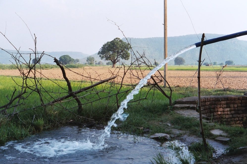 Electric pumps lift groundwater. Ajaigarh stands on a safe and secure butte rising above these plains.