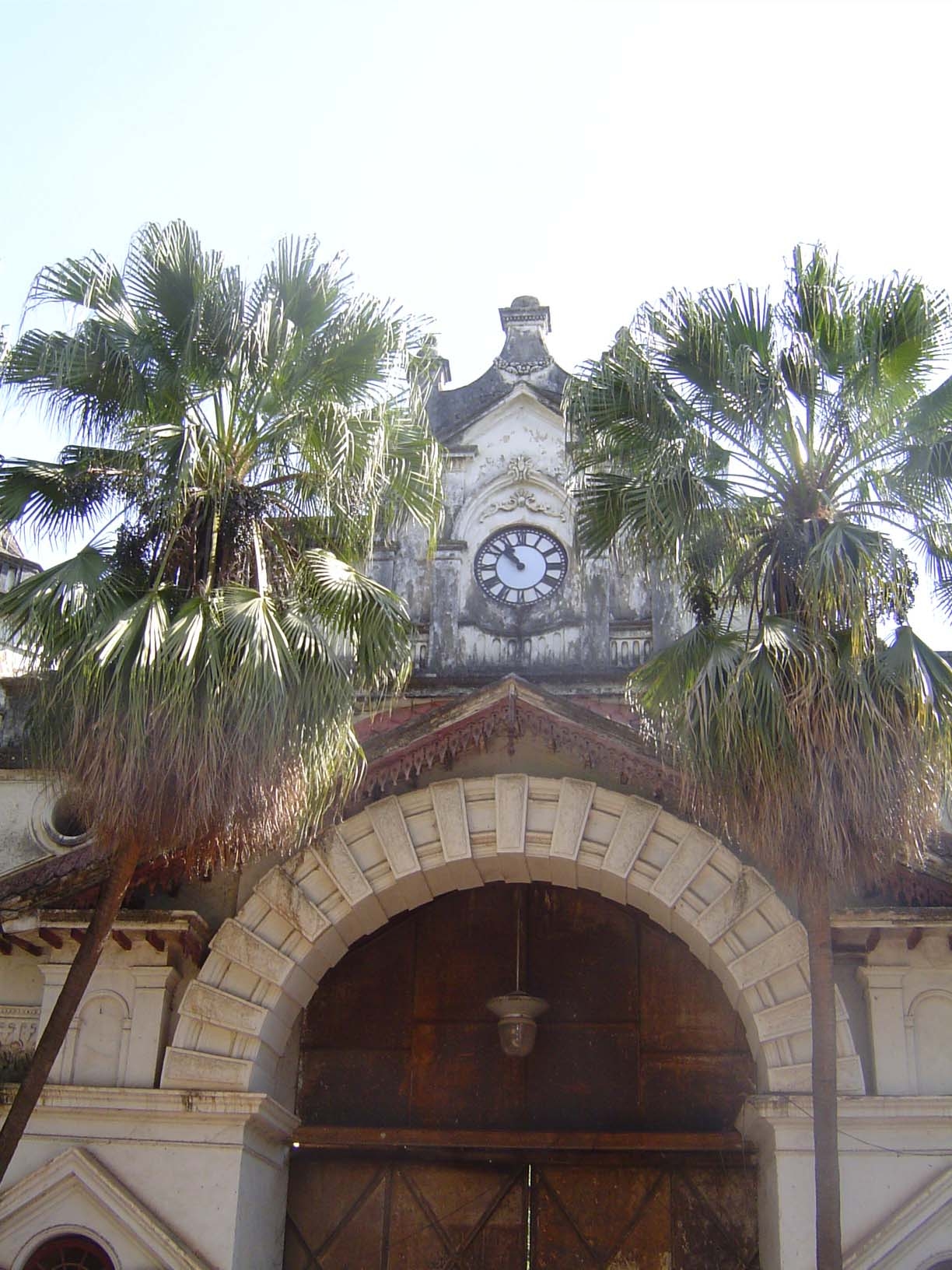 A side entrance, barred tight.
