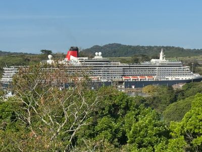 Yikes! We're about four miles from the Pacific Ocean.  This can't be real, you say, but it is: a Cunard Queen approaches the Miraflores Lock