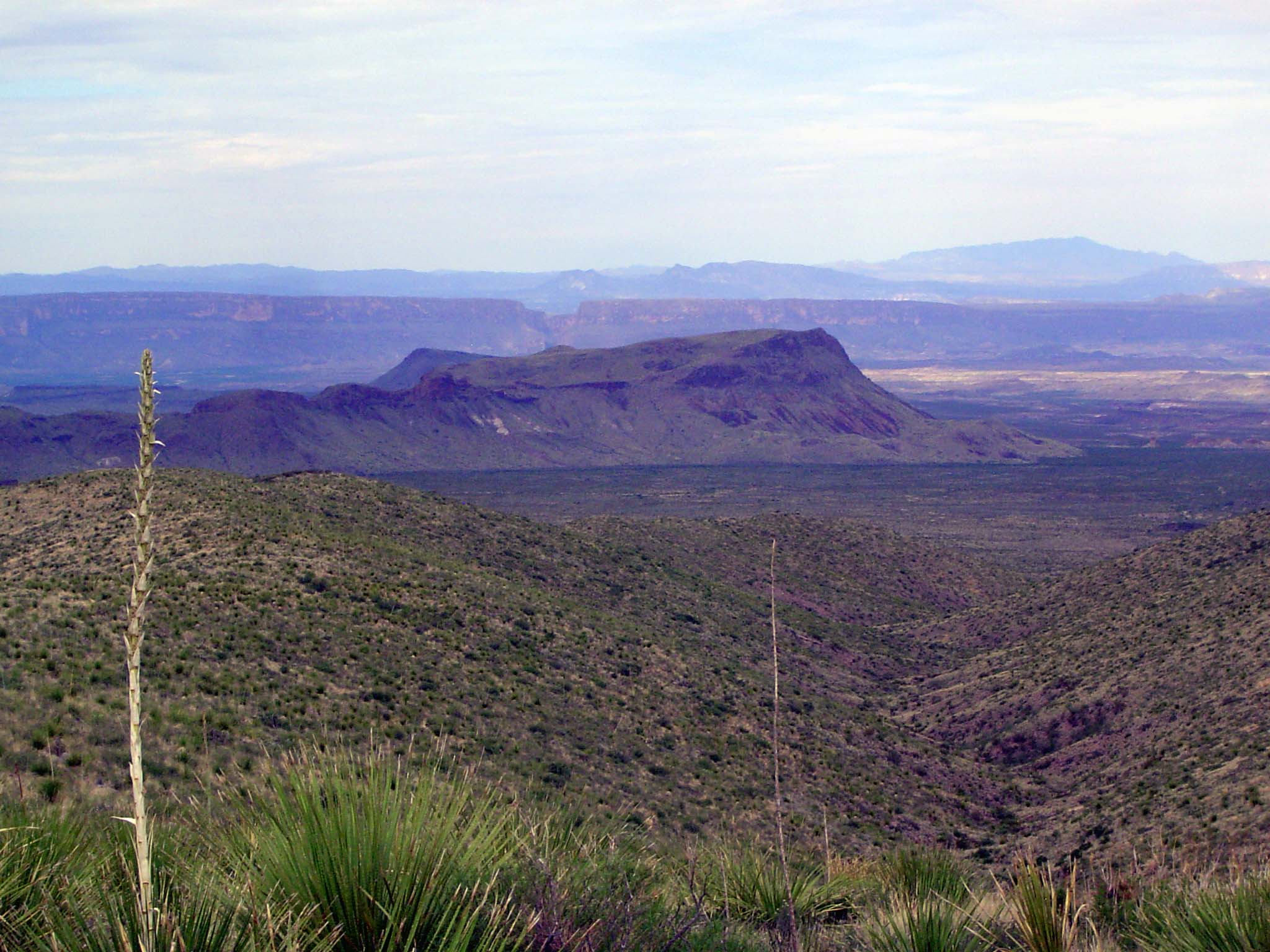 Looking south to the ridge of the Mesa de Anguila. The Rio Grande cuts through it with that slit in the middle of the image. It's the Santa