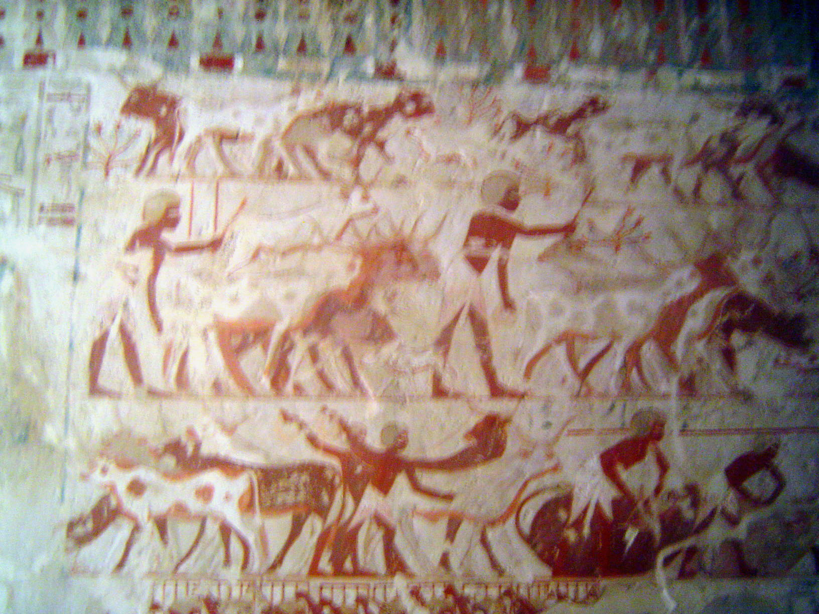 On a more factual note, cattle gambol at the top, are driven on the middle level, and are branded at the lower right.