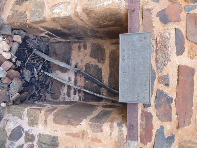 Who says hard-boiled businessmen don't have their sentimental side?

A photo of the fireplace, showing it as it is here save for a low raili