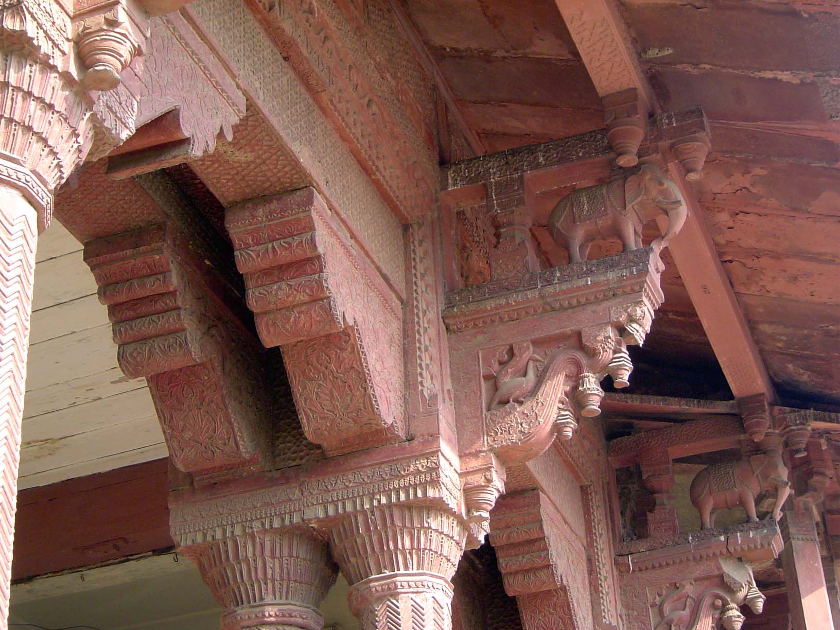 Various animals are carved into the brackets, here with elephants and peacocks.