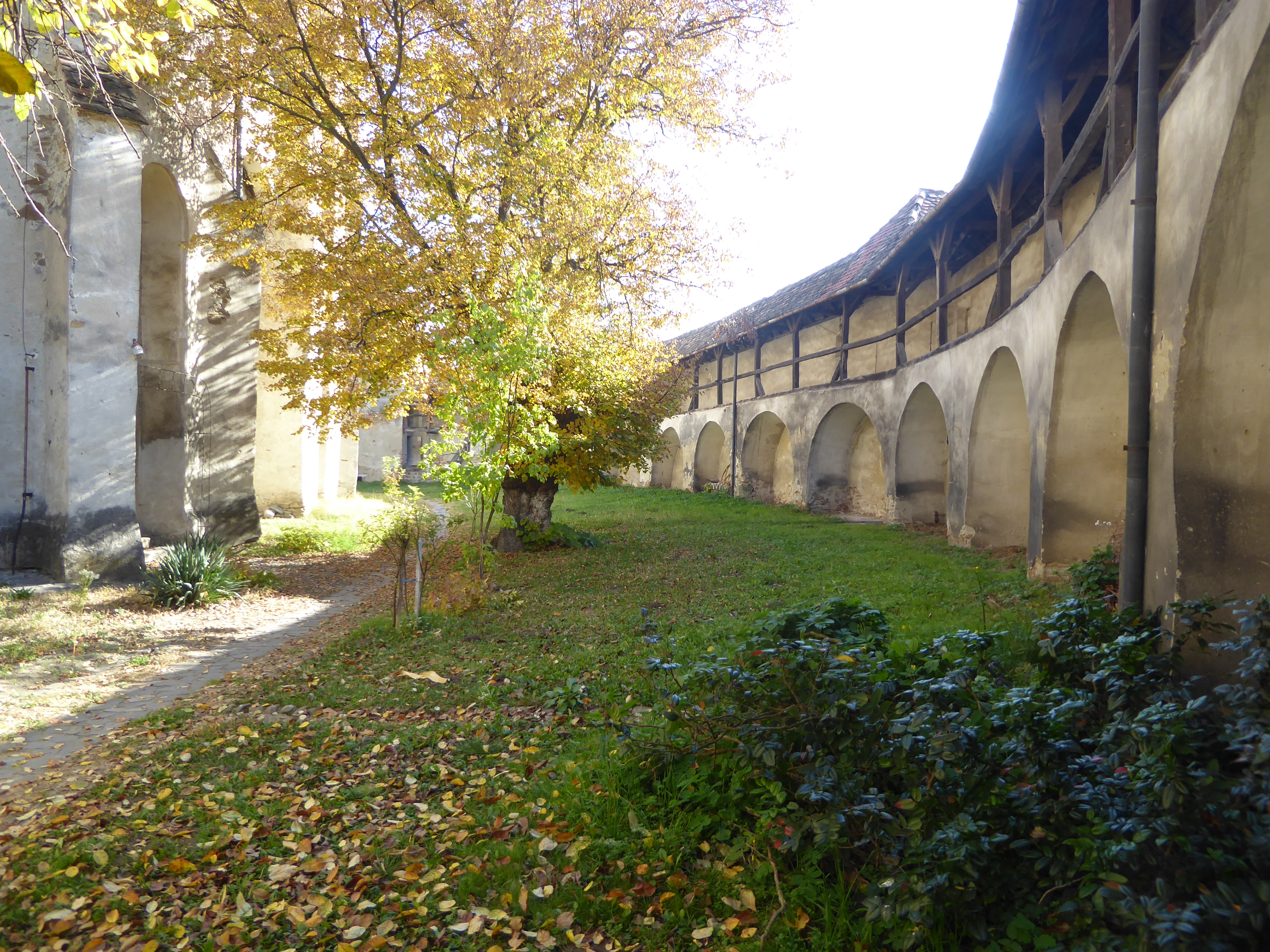 The encircling wall's storerooms were demolished in the 1960s, but the wall-walk was restored.