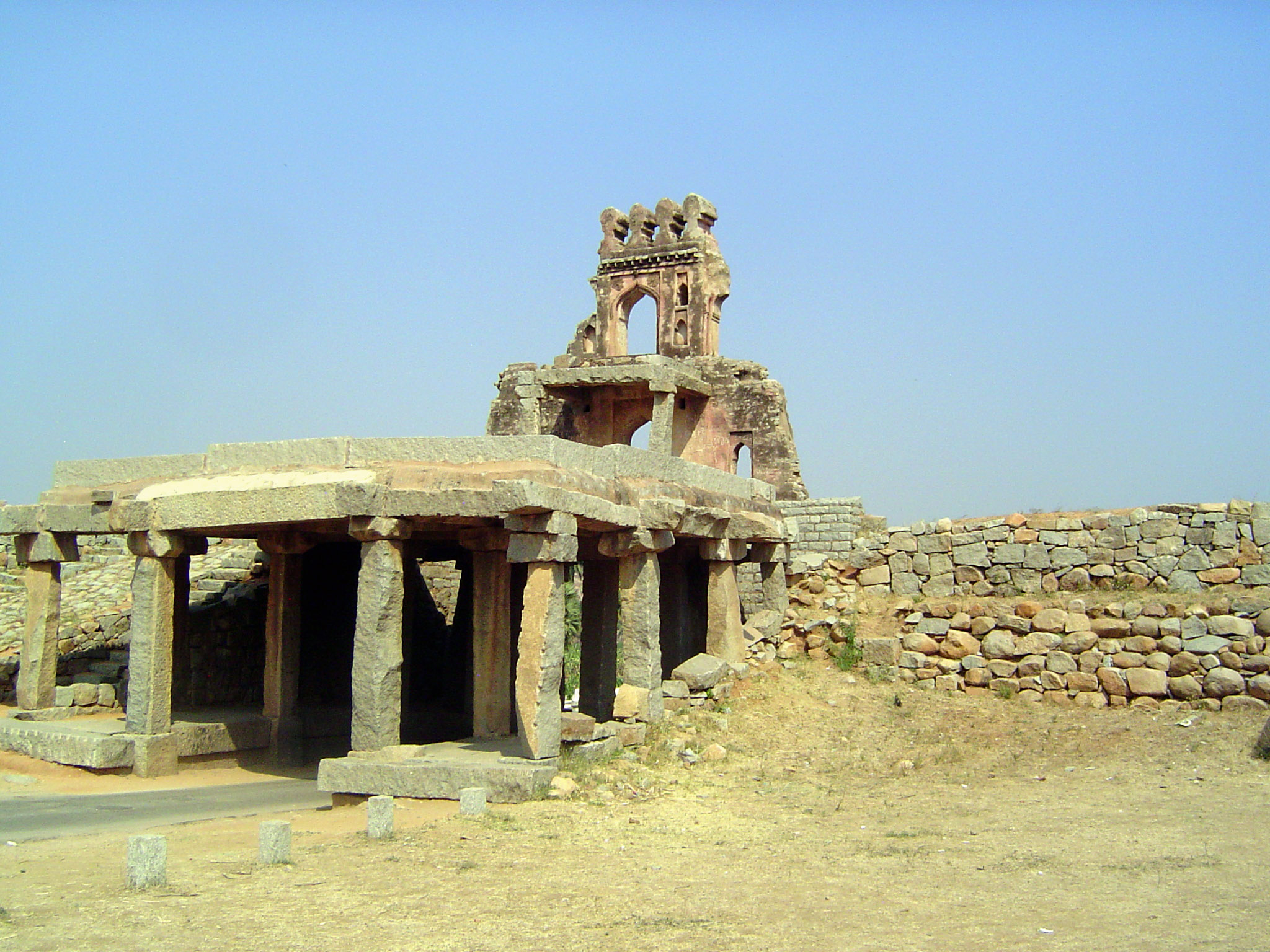 The gate had a brick and plaster superstructure with rooms, but they're gone.