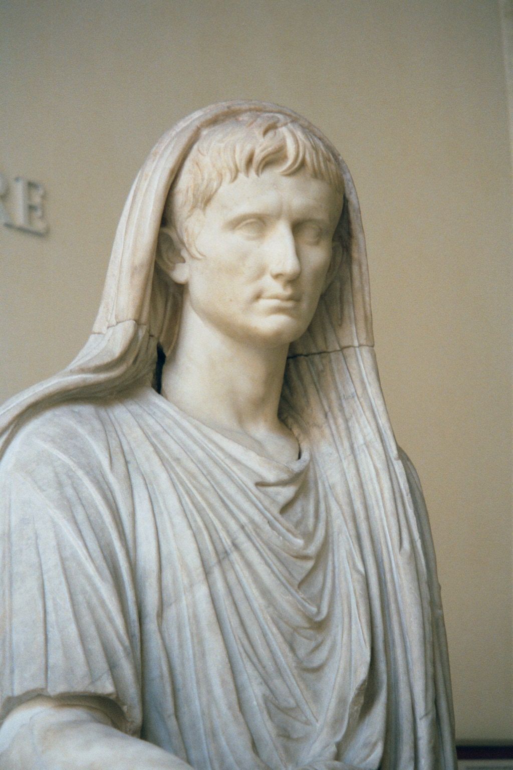 Augustus Caesar as Pontifex Maximus, in the Palazzo Massimo. The statue seems benign but indicates a totalitarian consolidation of political