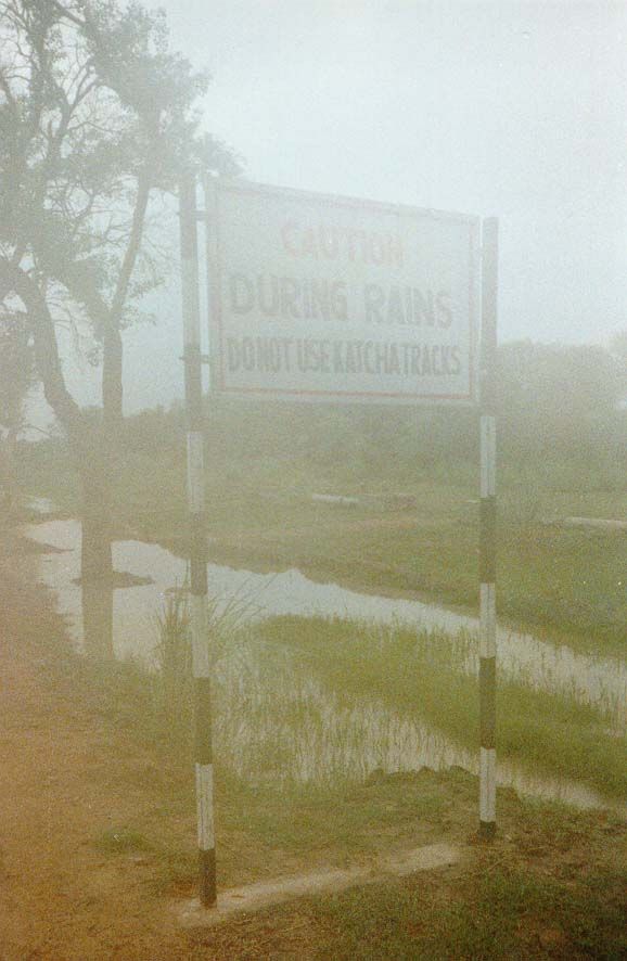 Caution. During rains do not use katcha tracks. Translation: stay off unpaved roads during the monsoon. This particular sign, passed during