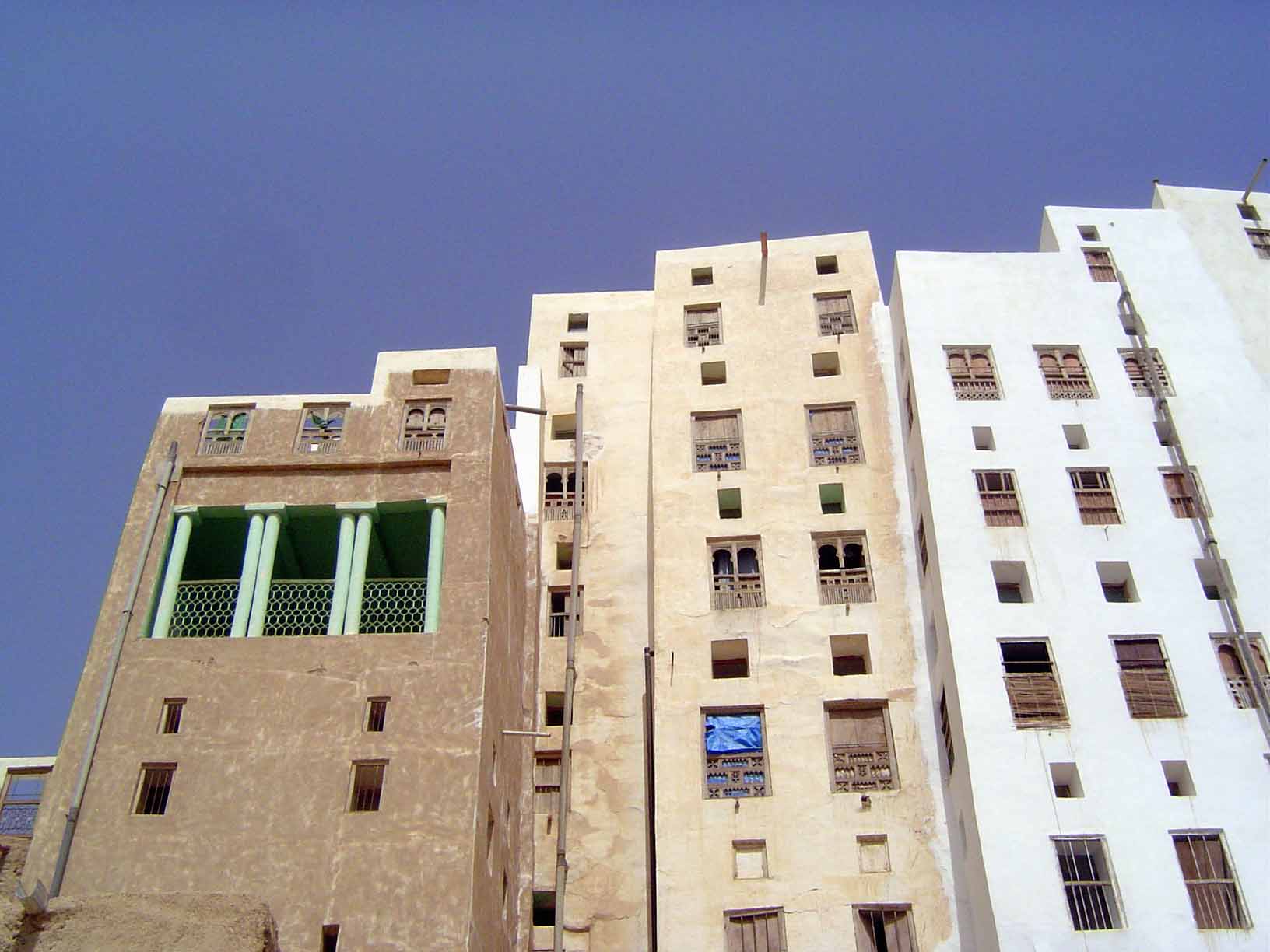 The balcony is unusual but even more suggestive of Manhattan. The general design of the houses, like those in Sana'a, is for a central pier