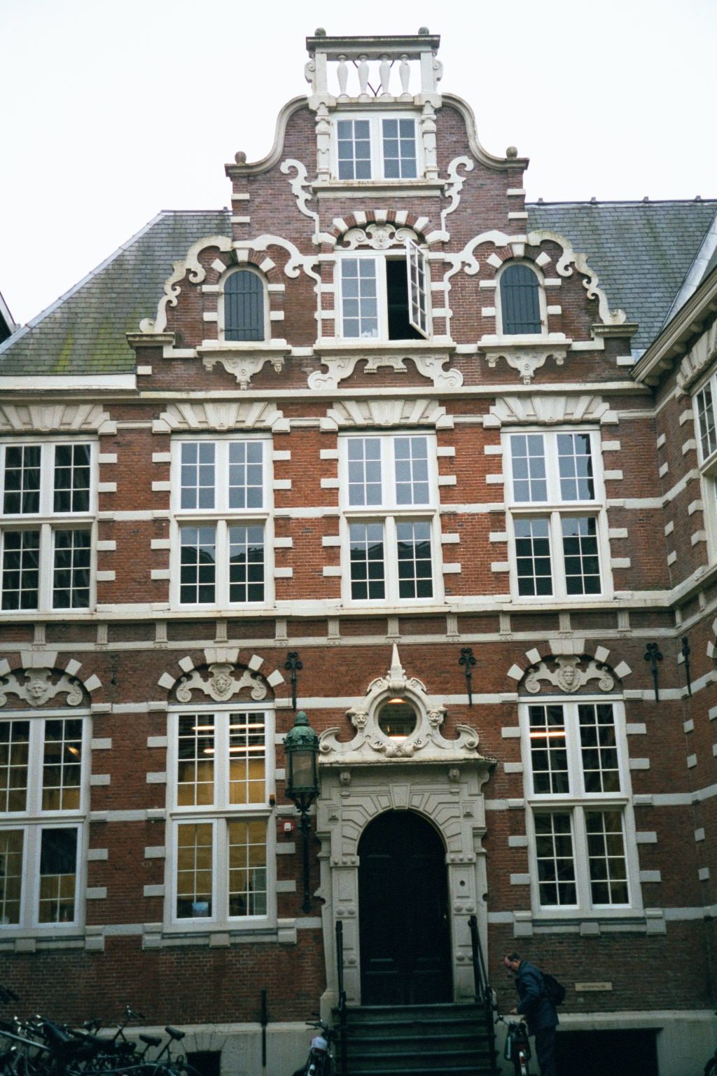 A side entrance. The bicycles hint at the building's current use as part of the University of Amsterdam.