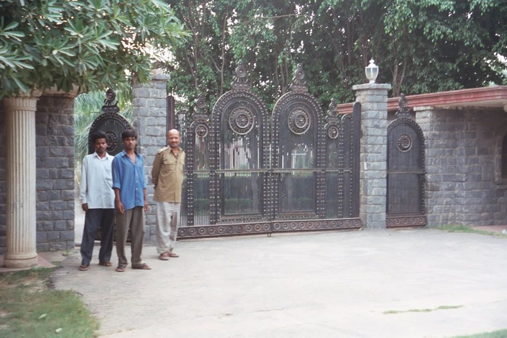 Far out on the city's southern fringe, the wealthy have built hundreds of walled estates known, misleadingly, as "farms." Here, the gate to