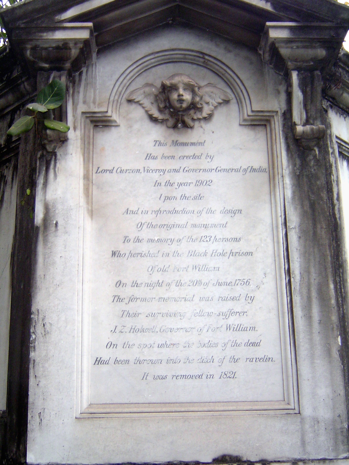 The original inscription, by Curzon, listed the names of the victims and said that they "were, by the tyrannic violence of Siraju'd daulah '