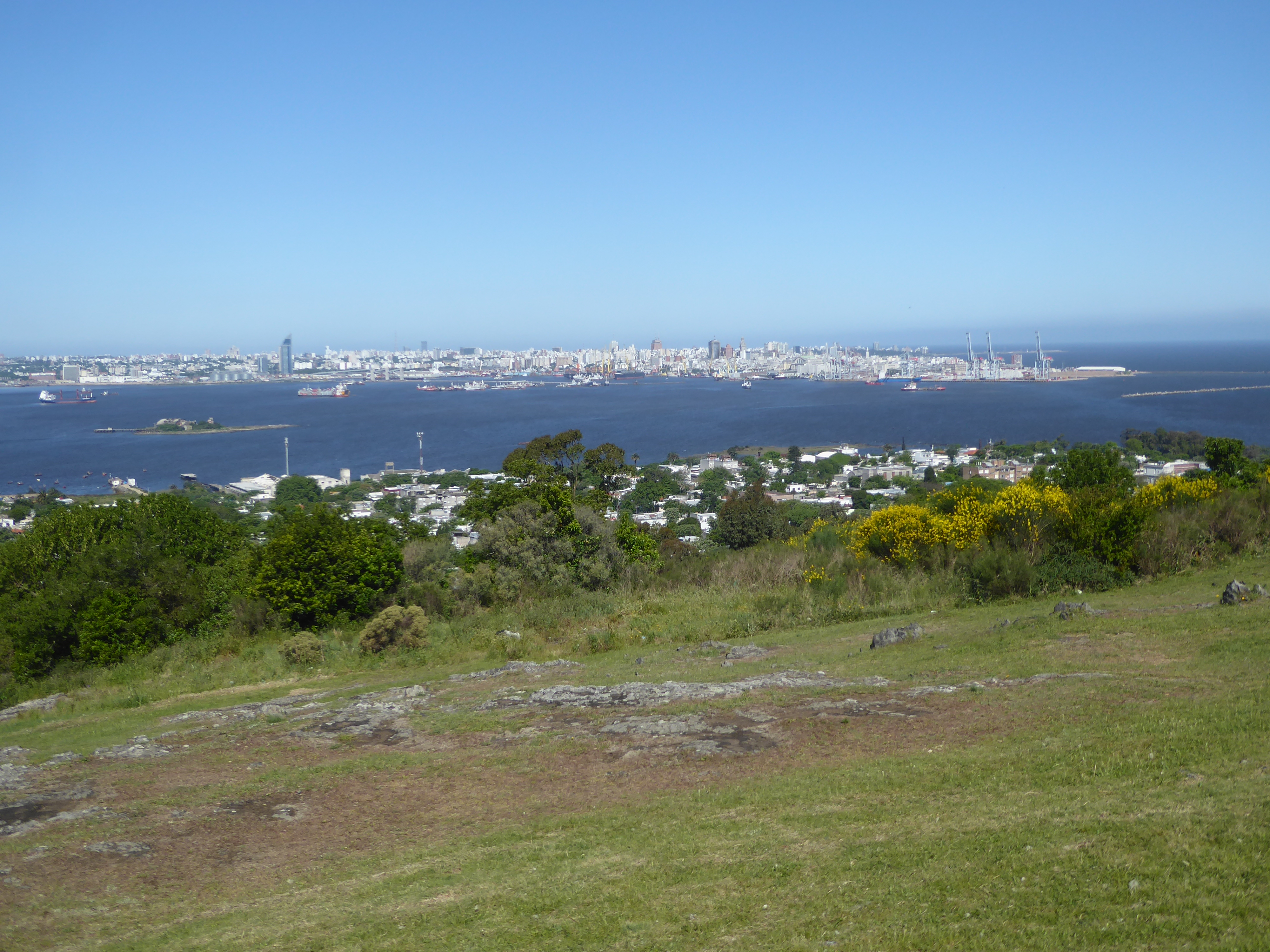 There's a fine view across the harbor to the Mulhall's "tongue of land." Three ship-to-shore cranes stand at the tip of the tongue, a penins