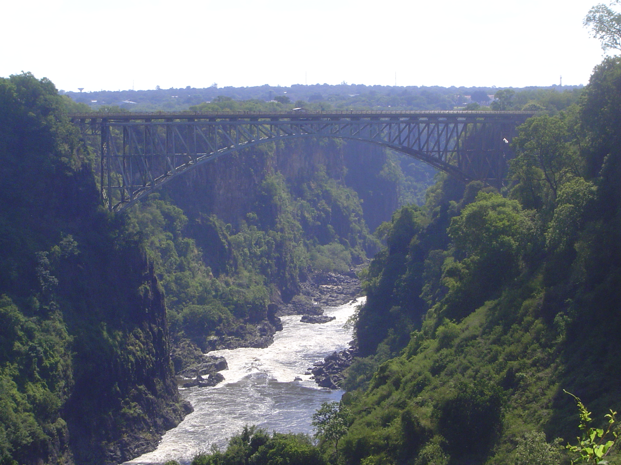 Downstream a few hundred yards is the Victoria Falls Bridge, built in the UK, shipped to Mozambique's Beira, brought here by rail, then reas