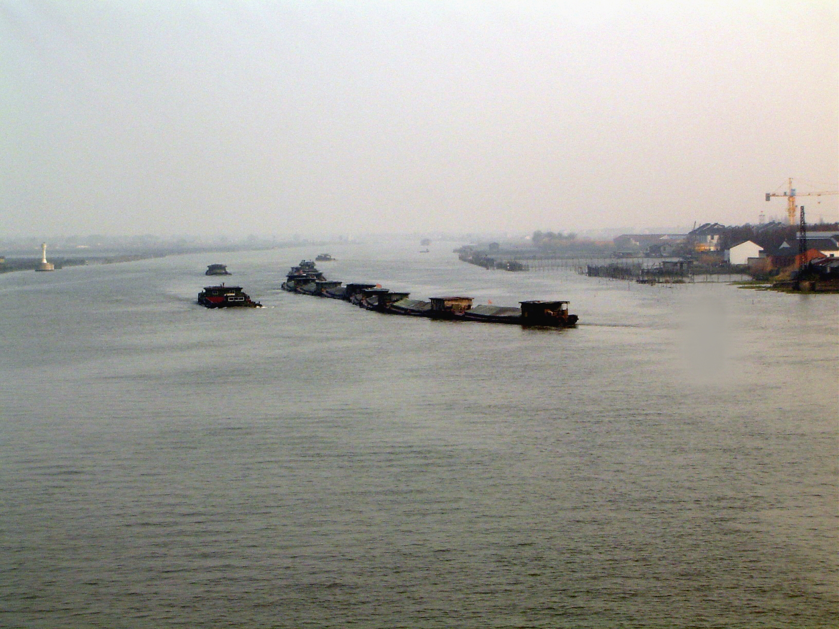 The Huangpu is a short 60 miles dredged tributary of the Yangtze. It originates in Lake Djanshan, which is linked to a network of other lake