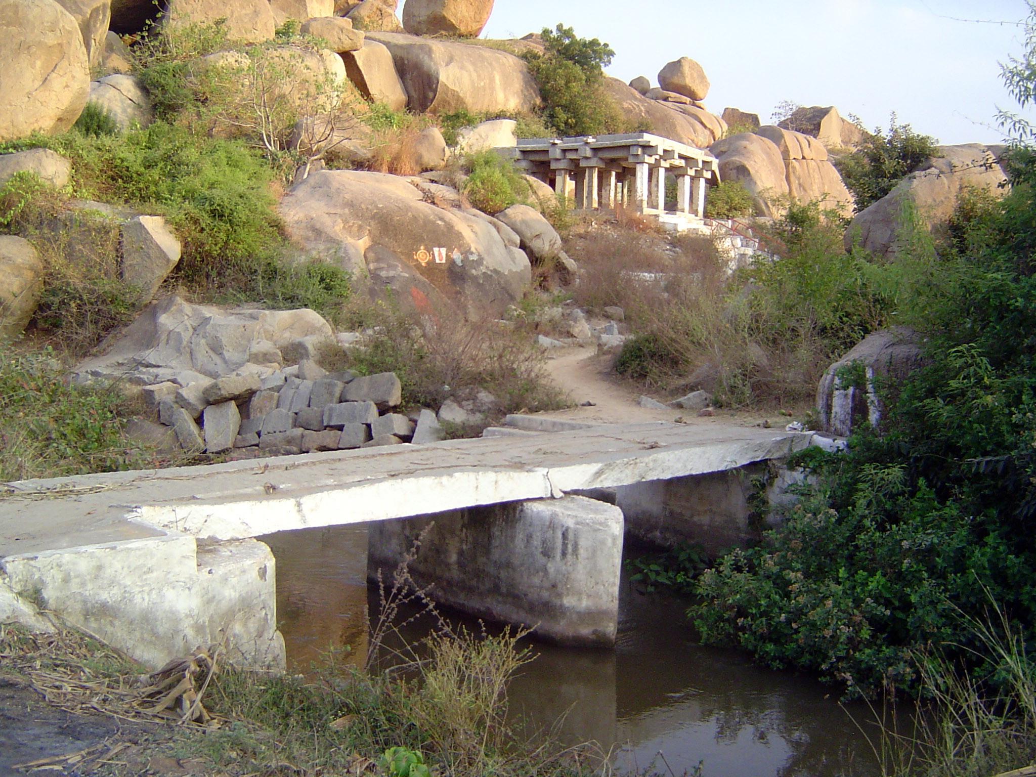 A new bridge leads to an old temple.