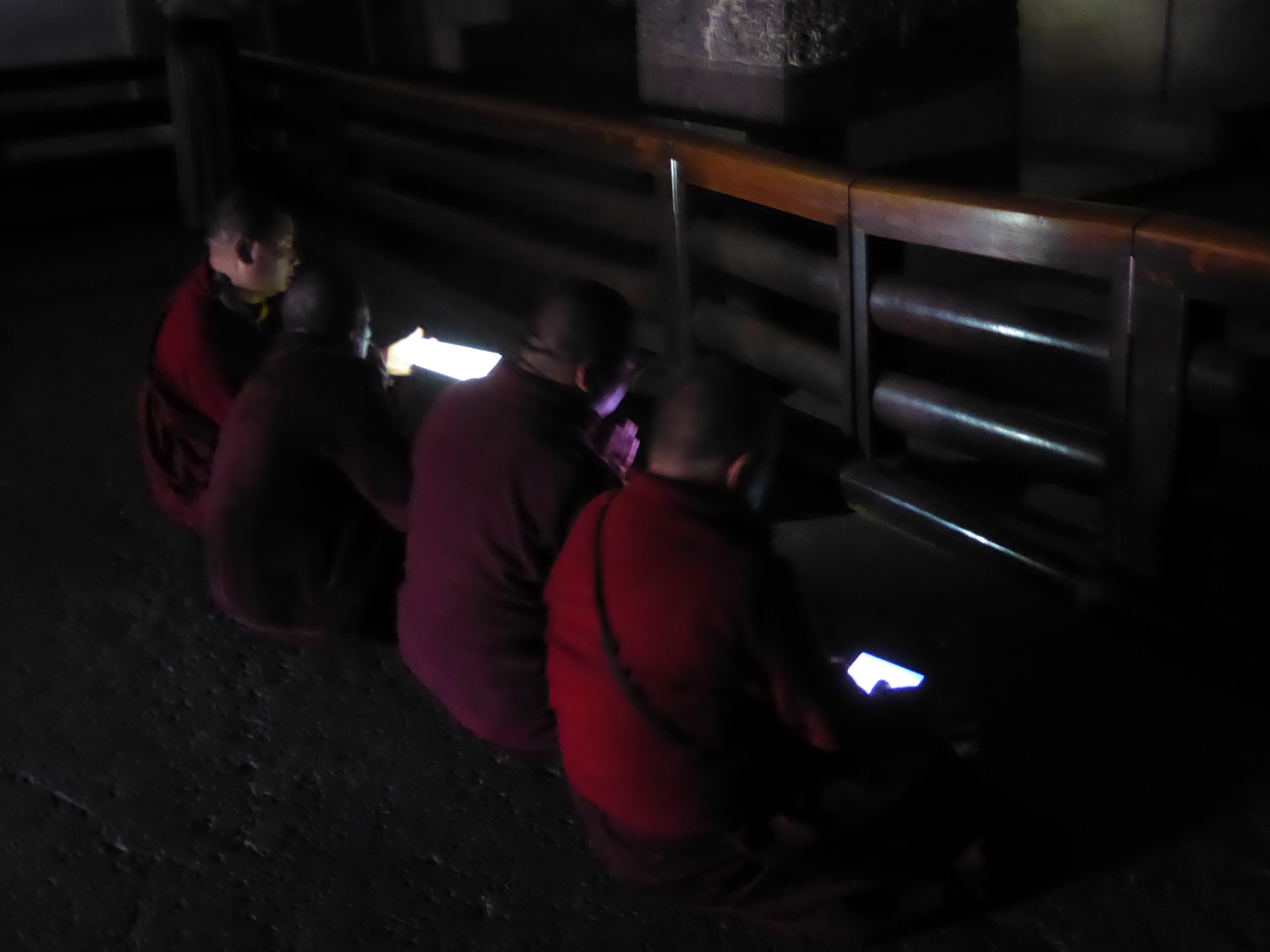 Modern monks manage to ignore the crowds and pray with a little help from iPads.