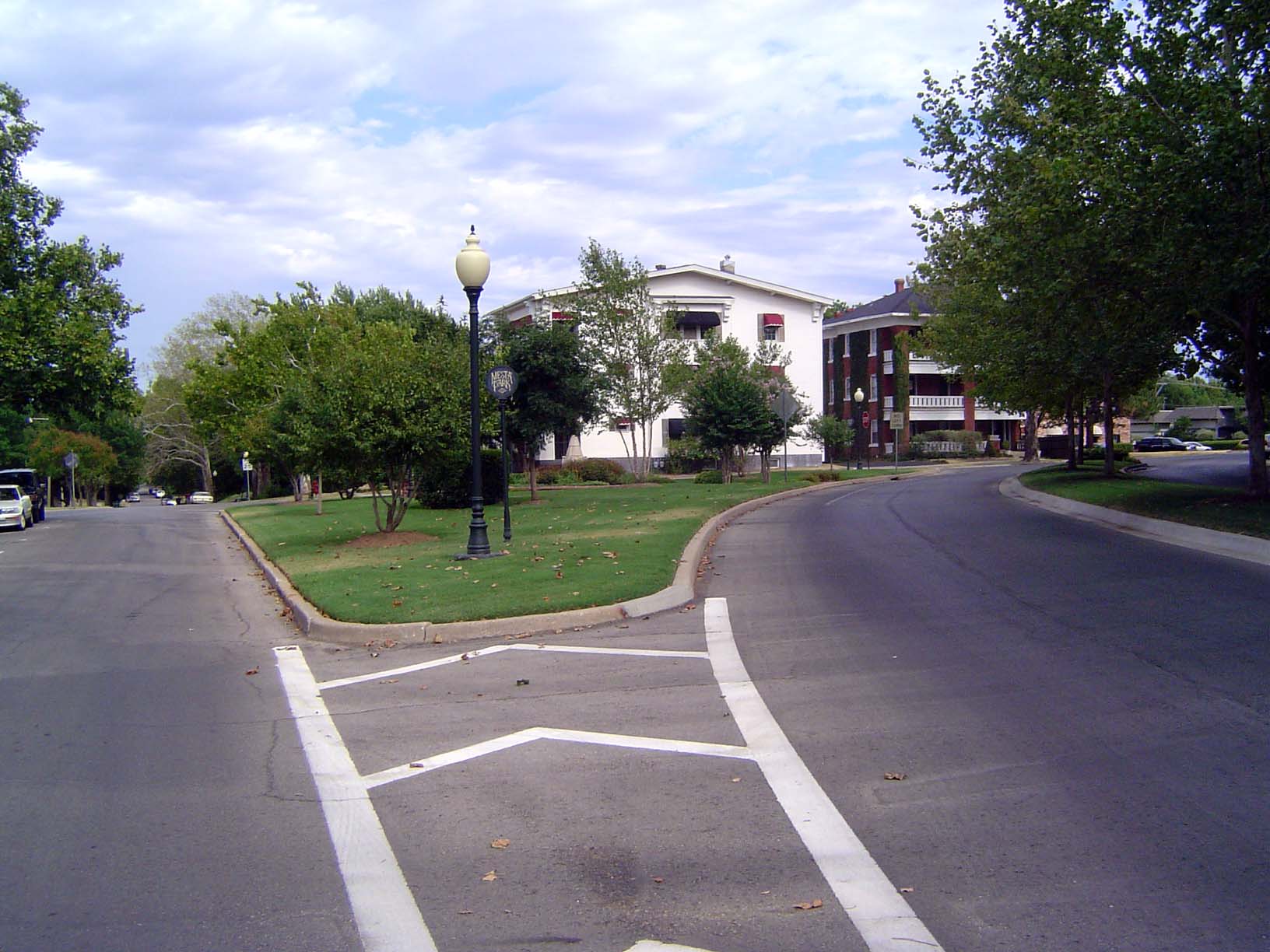 Same place, here looking east on 18th Street, where the track curved south to Shartel. This is an area generally of big single-family homes,