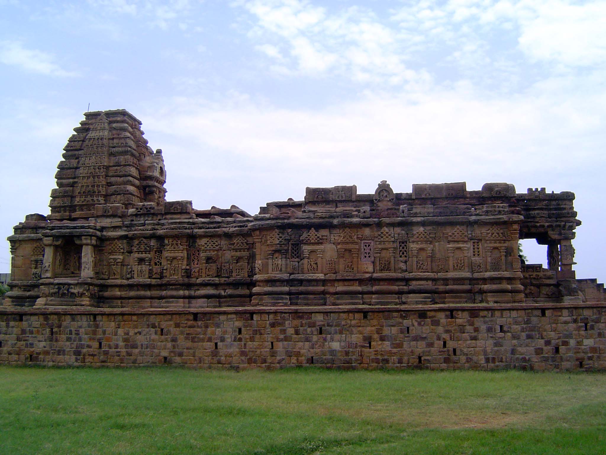 Still farther south, the Papanatha Temple, enlarged at the time of the construction of Virupaksha but with a spire in the northern style. Or
