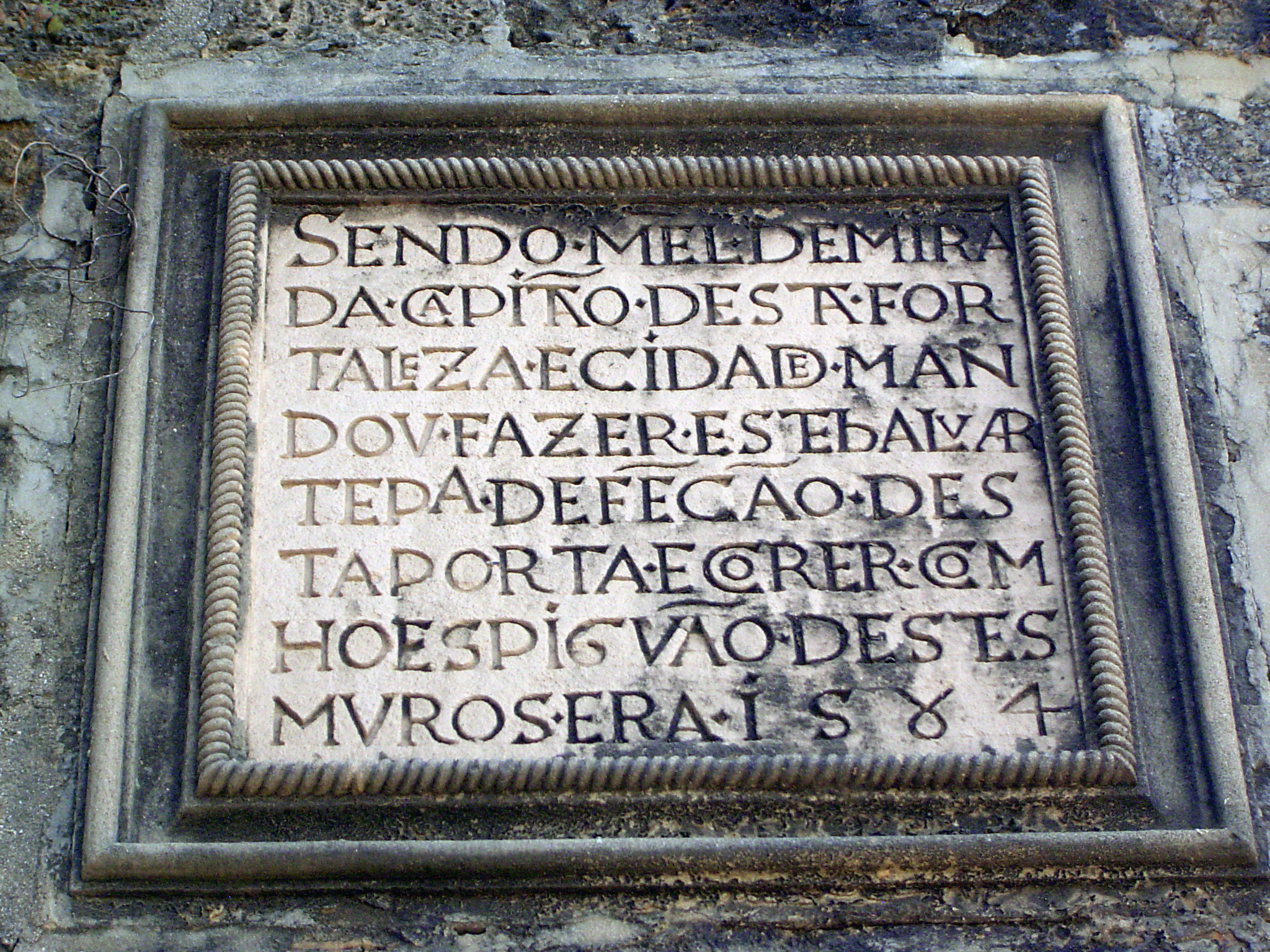 The inscription states that the adjoining Tower of St. Peter's was built by order of Manuel de Miranda, captain of the fort and the town, to