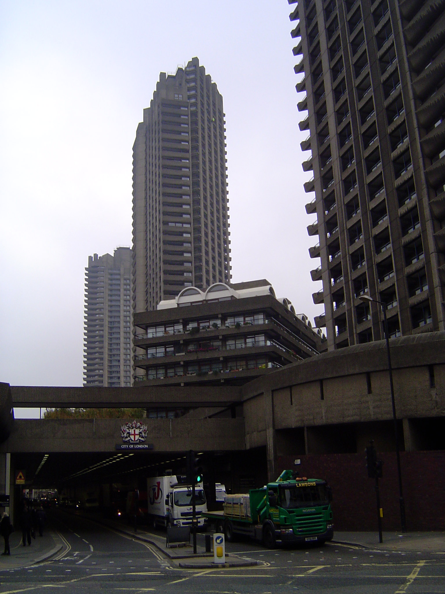 Grim? This is the Barbican Estate with three tall but by no means cheap apartment buildings on a site cleared by the blitz. Pevsner write th