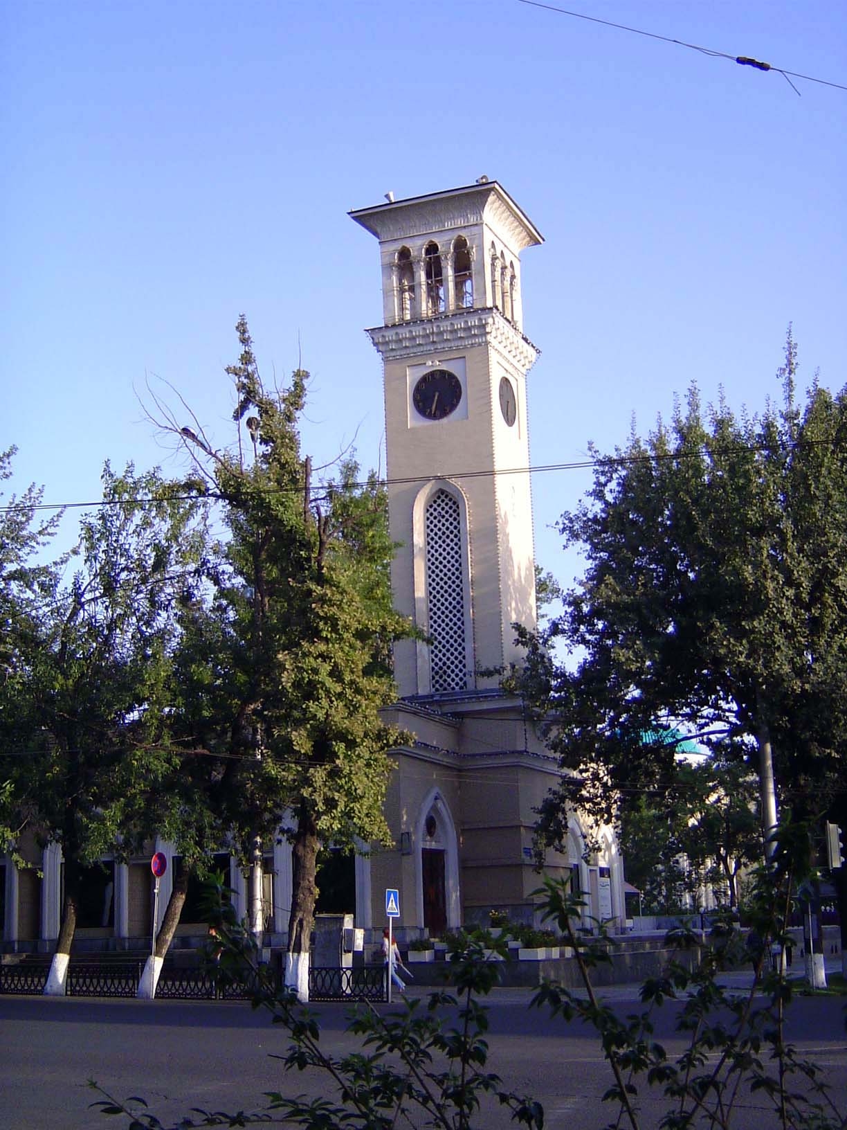 At the park's edge: a clocktower, the arch-symbol of progress.