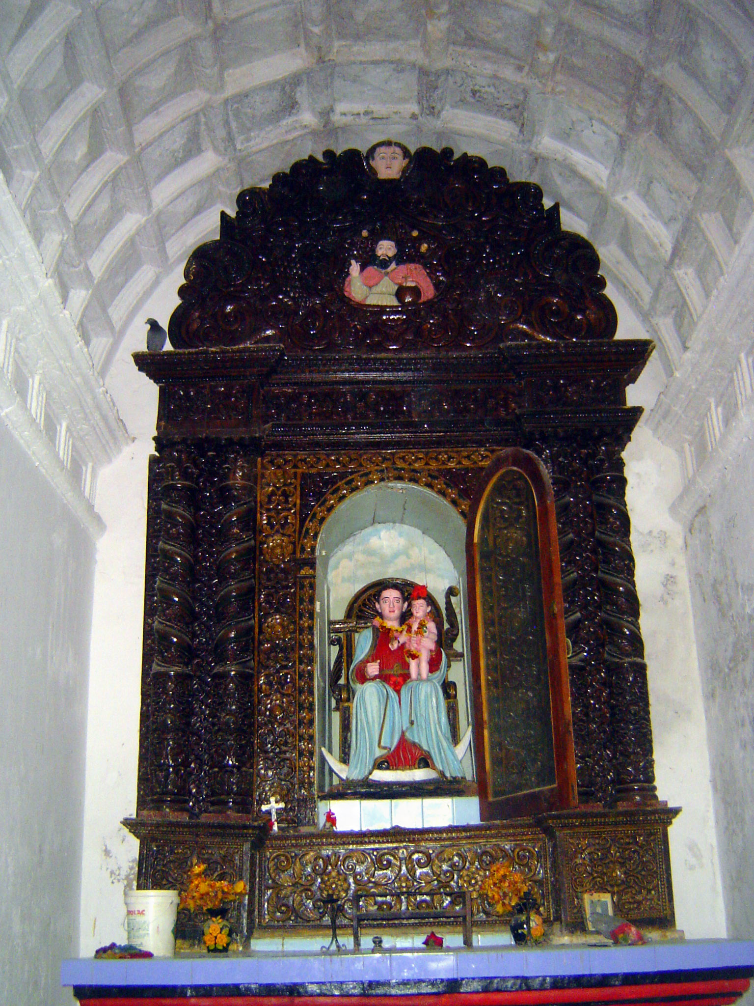 Once again, the nave has a masonry vault but the elaborate altarpiece is wood from somewhere.