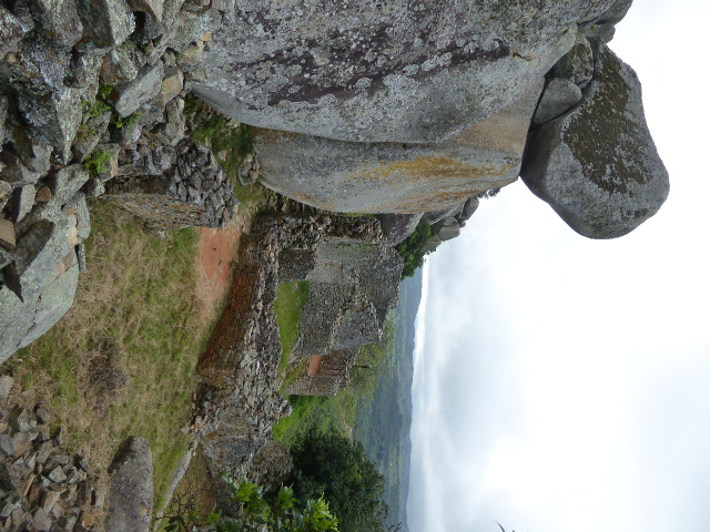 We're skirting the top of the mountain. The rooms up here were too irregular to have been roofed.