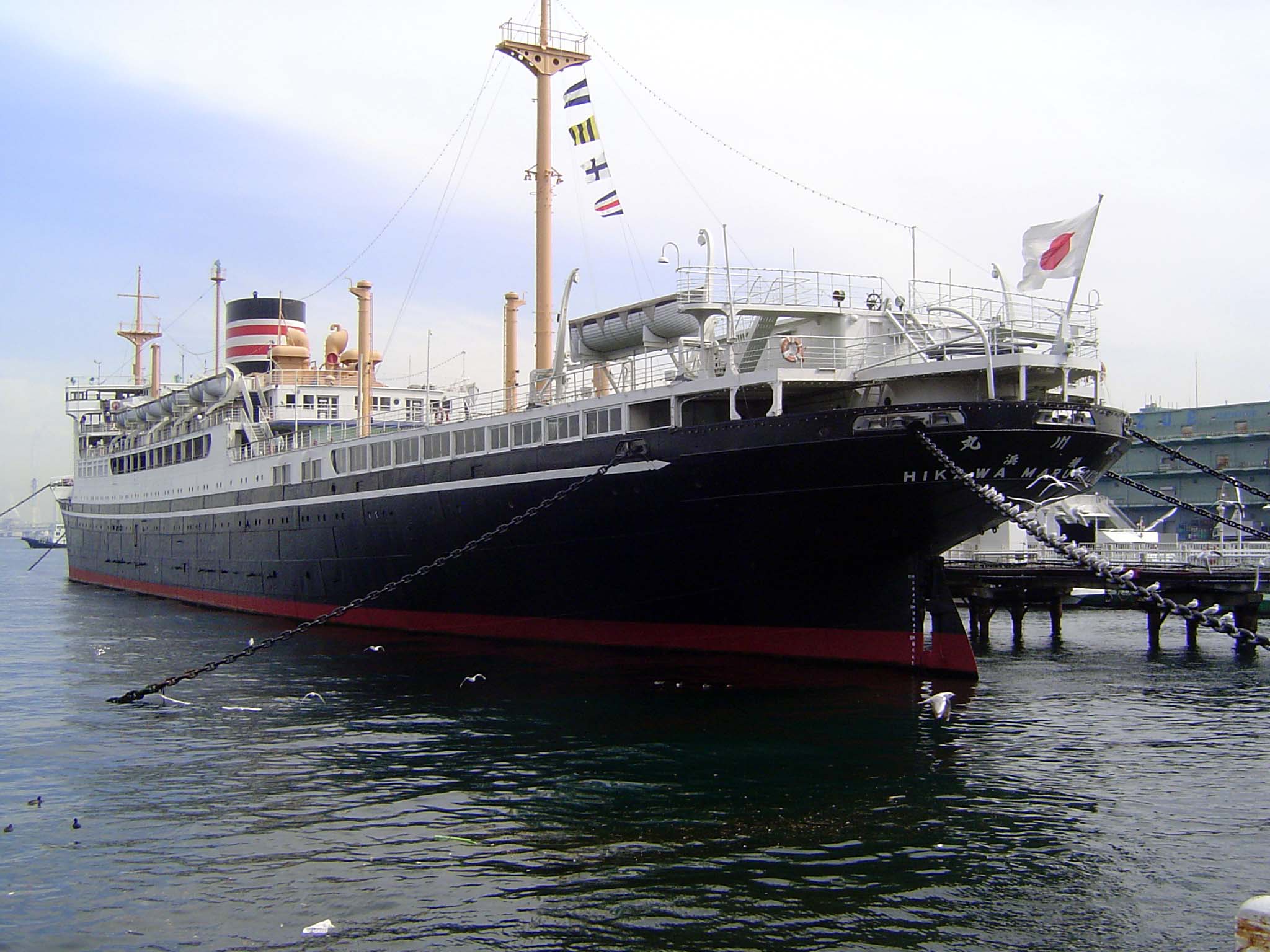 Parked alongside the frontage is the retired Hikawa Maru. Its maiden voyage was from Kobe to Seattle in 1930, and it made over 250 Pacific c