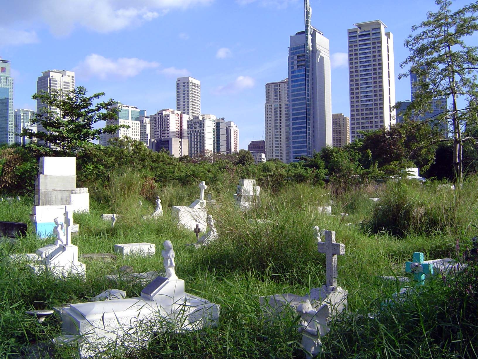 Some of the homeless, with Makati in the background.