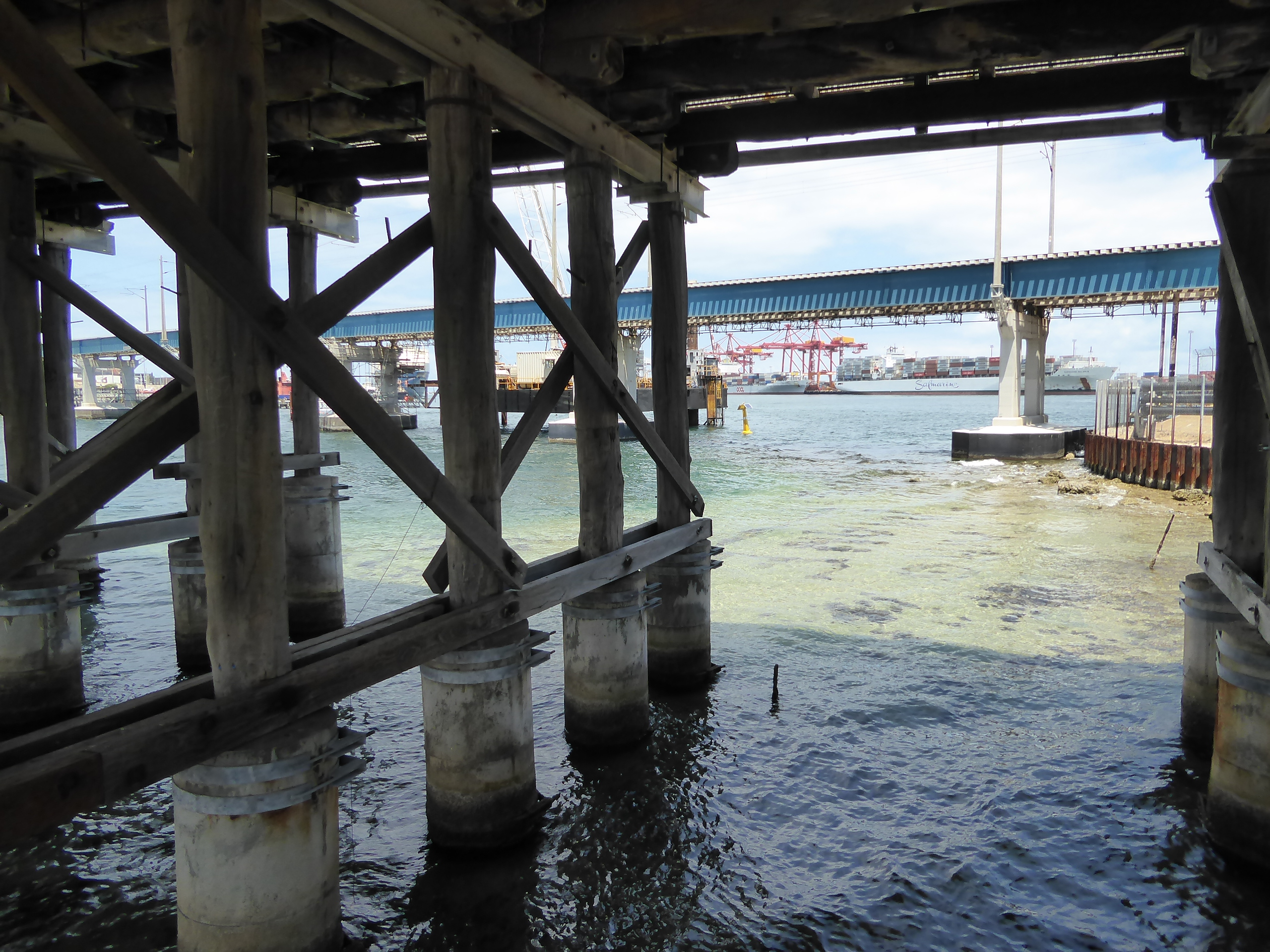 Looking downstream under two road bridges we find the serious end of the river's mouth.