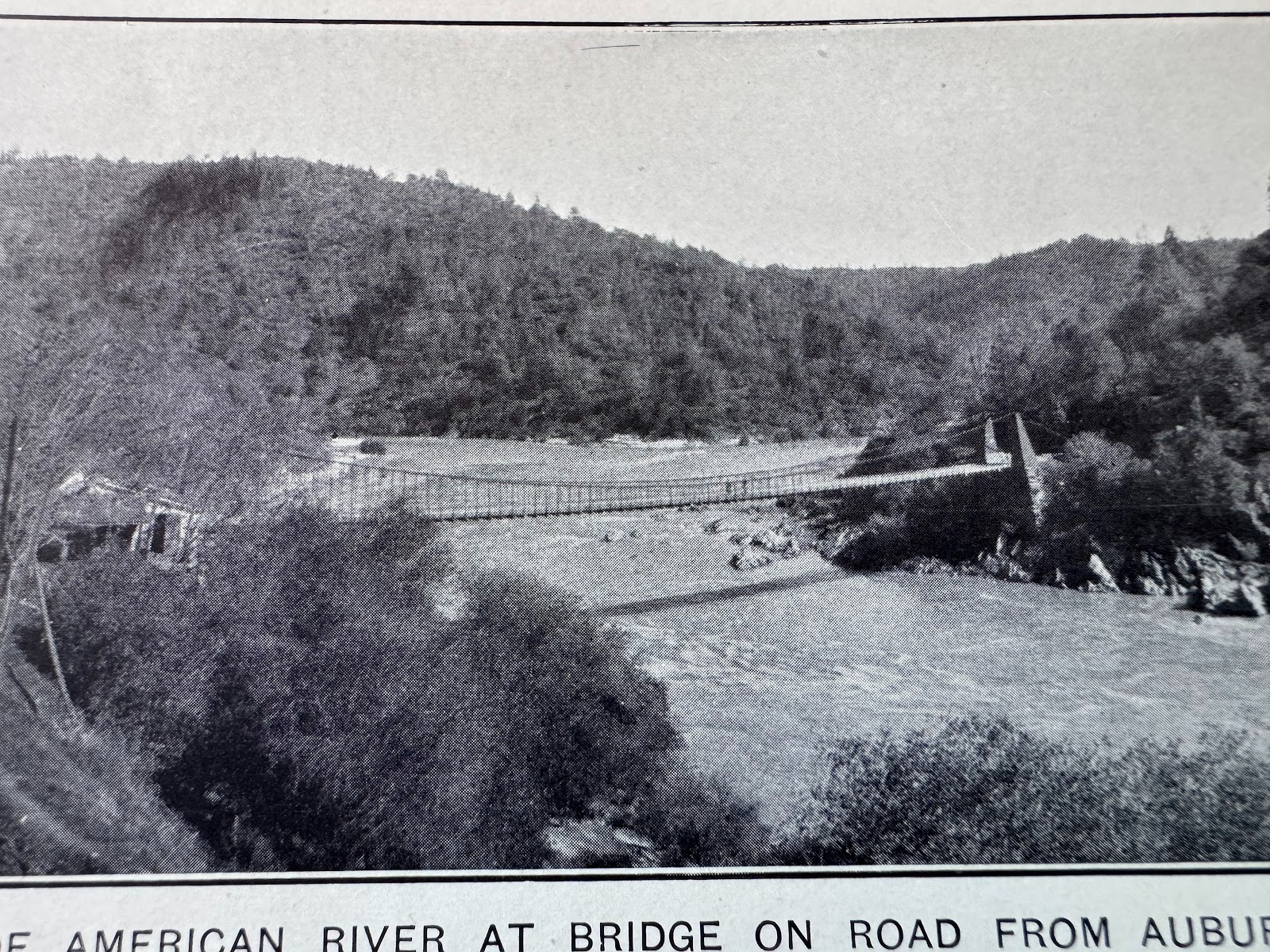 An early bridge at approximately the same site.  Notice the gravel-choked canyon.  More of that anon, but think "hydraulic-mining debris."