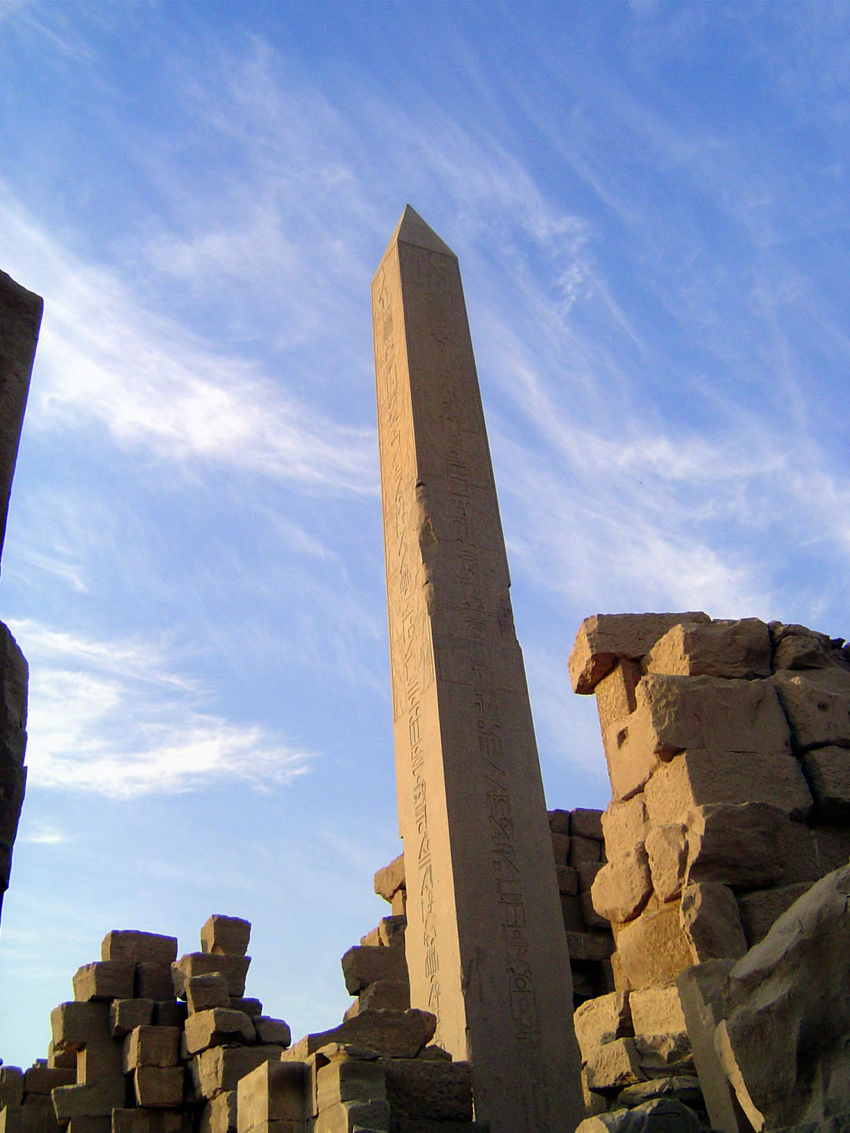 We're retreated to the obelisk of Hatshepsut. It's 97 feet high and weighs something over 320 tons. Bare stone now, it was formerly covered