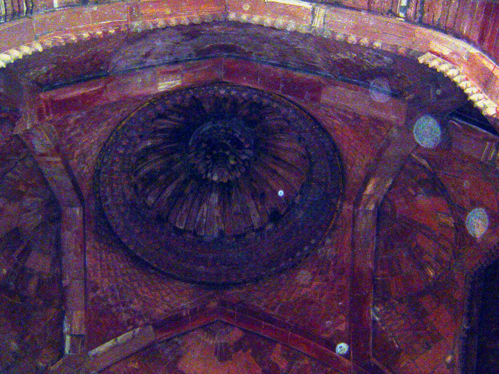 The crossing. Fergusson again: "Over the four arms of the cross the vault is plain, and of 23 1/2 ft. span, but in the centre it expands to