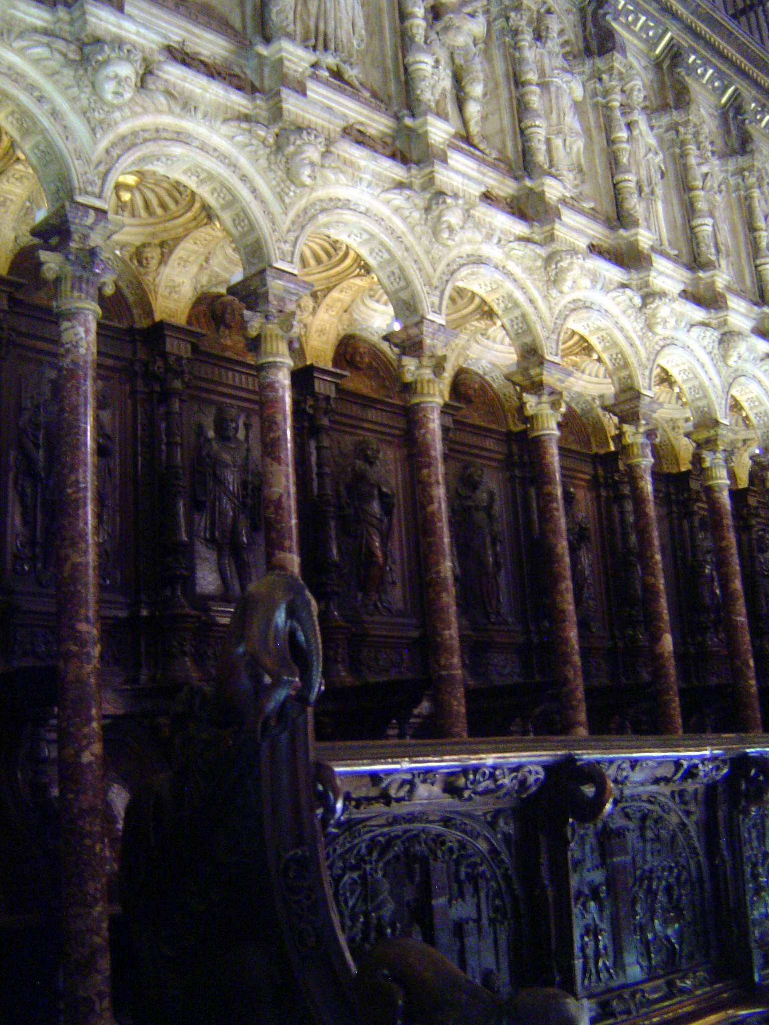 The carved stalls in the choir, from about 1540, recount the conquest of Granada, which at the time would still have been remembered by the