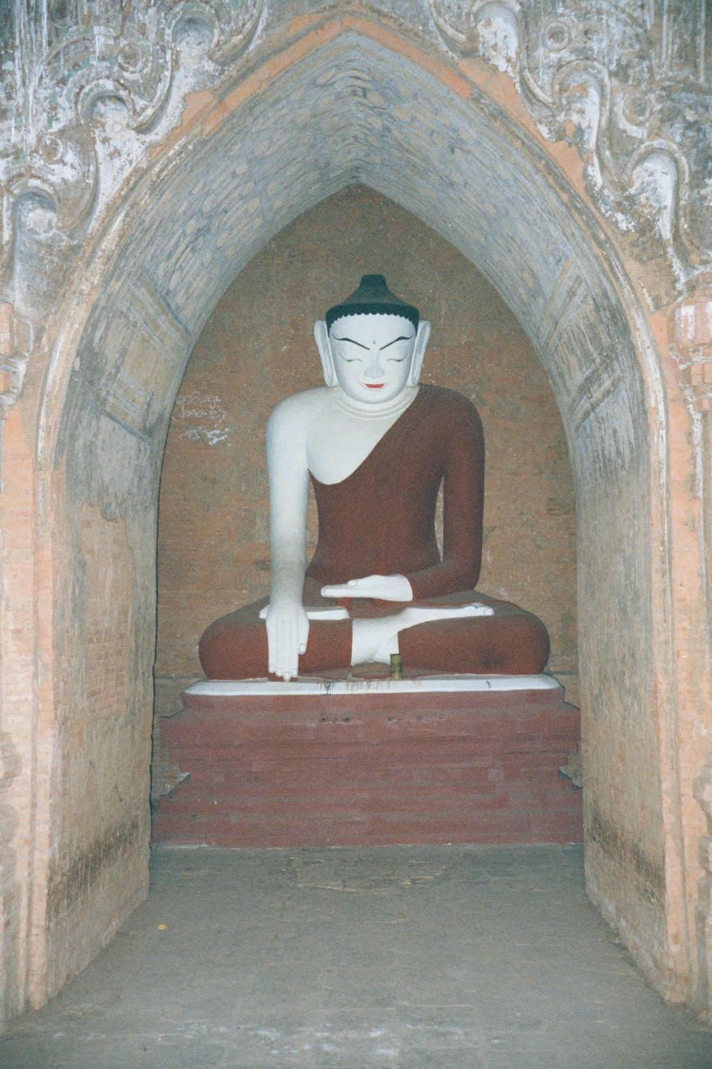 The Buddhas within are modern and rote but faithful to classical iconography: here, in the position of bhumisparsamudra, the Buddha touches