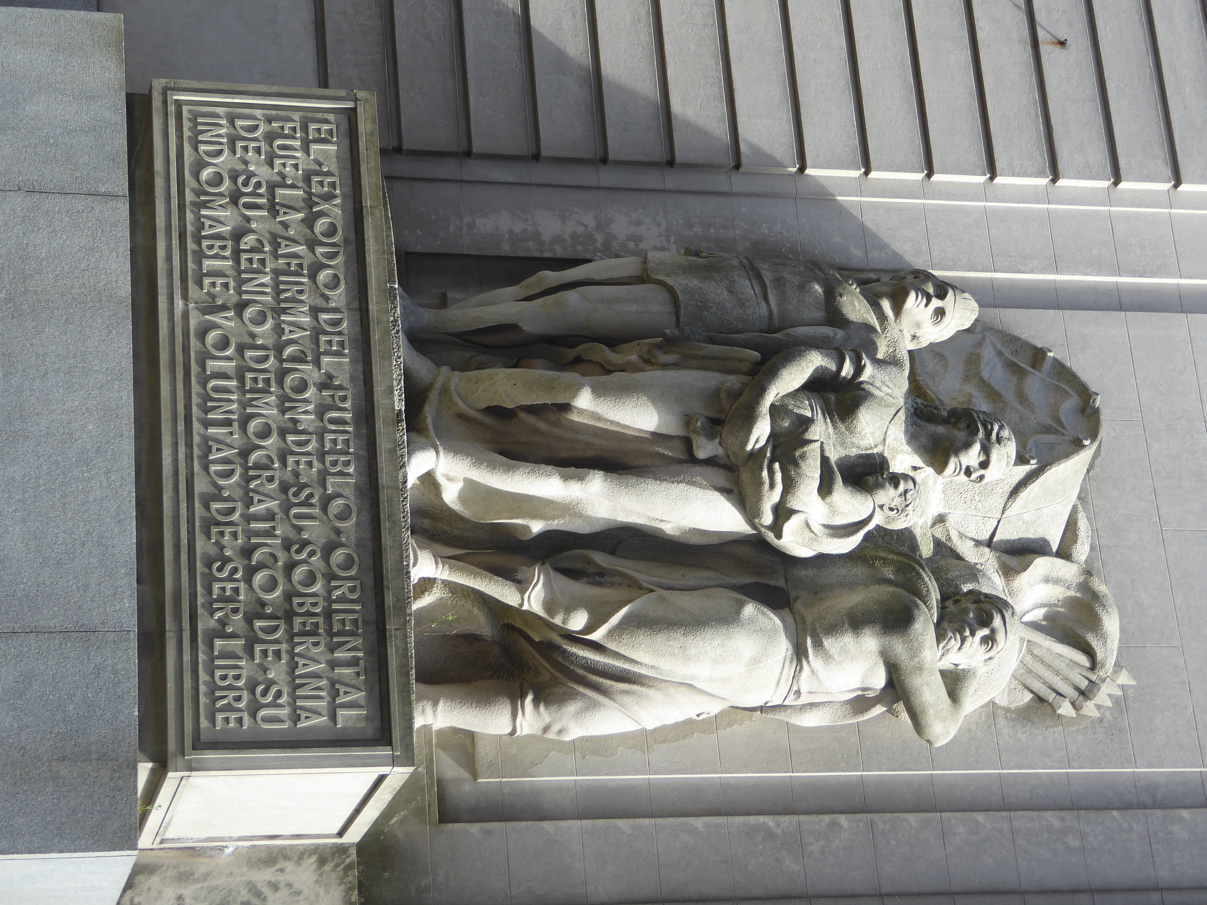 The sculpture is by José Luis Zorrilla de San Martin, son of Juan Zorrilla de San Martín, Uruguay's national poet. Could the words have been