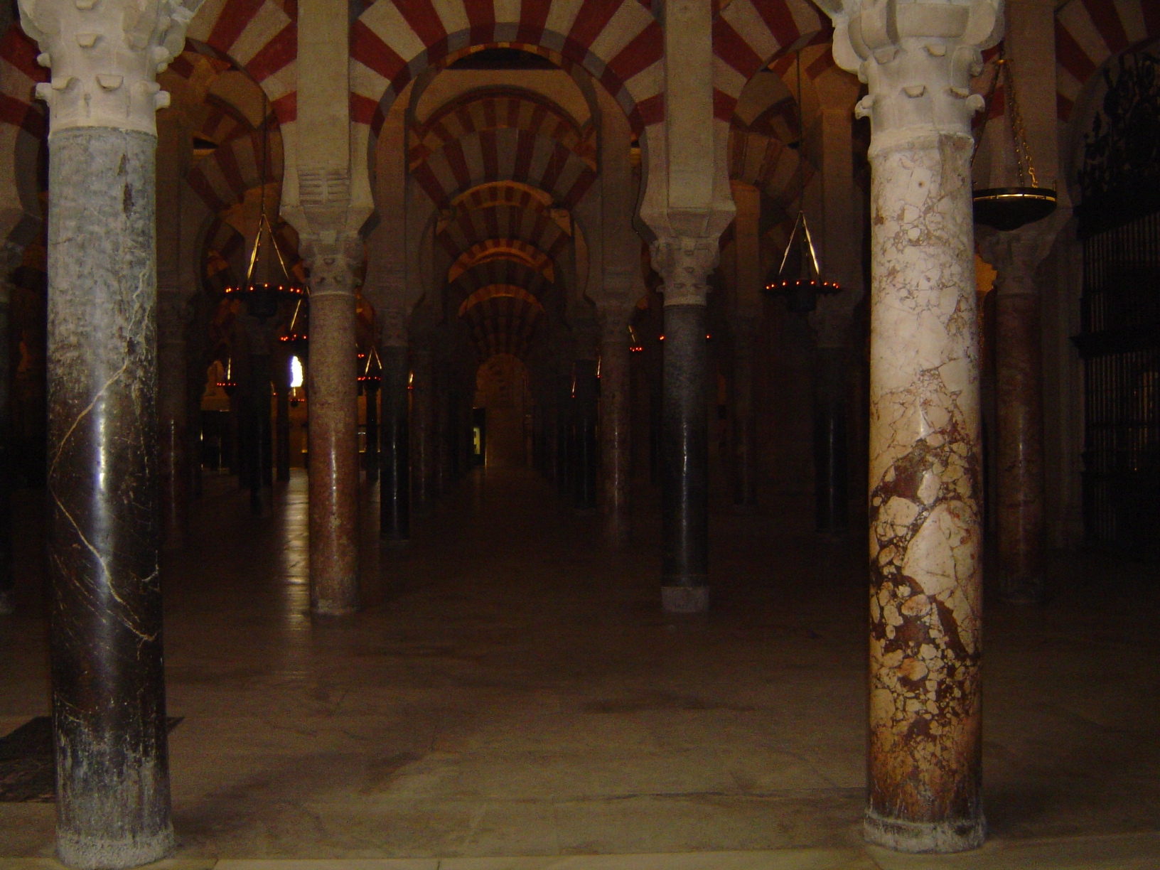 The walls came later, with the conversion to a church, and they explain why the interior of the old mosque is now so dark. In addition to da