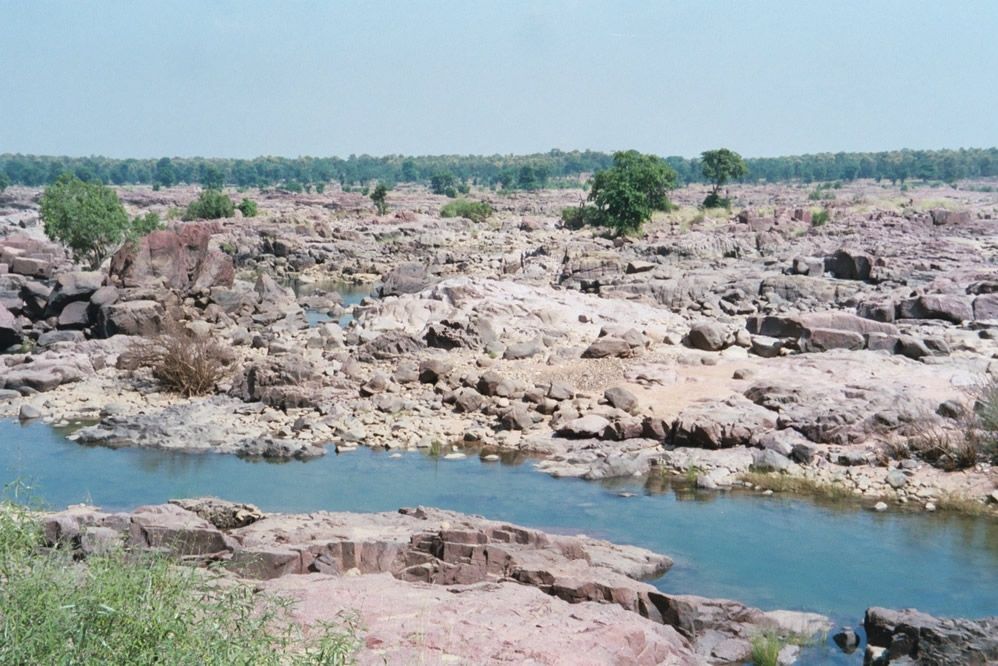 Then the forest opens to reveal a huge expanse of rock scoured bare by historic monsoon floods.