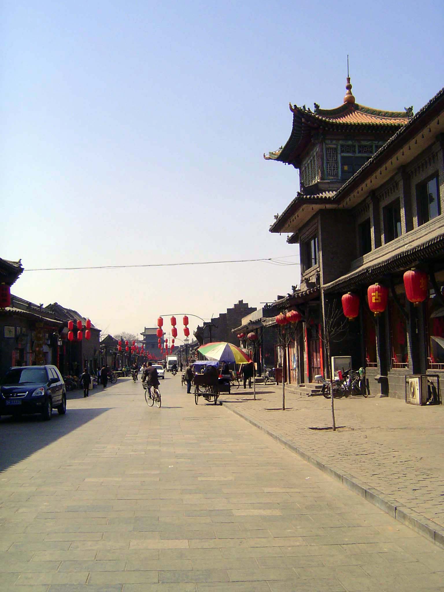 We'll venture inside the west or Fengyi Gate. Predictably, the streets are gridded. This is the primary east-west street, which runs from ga