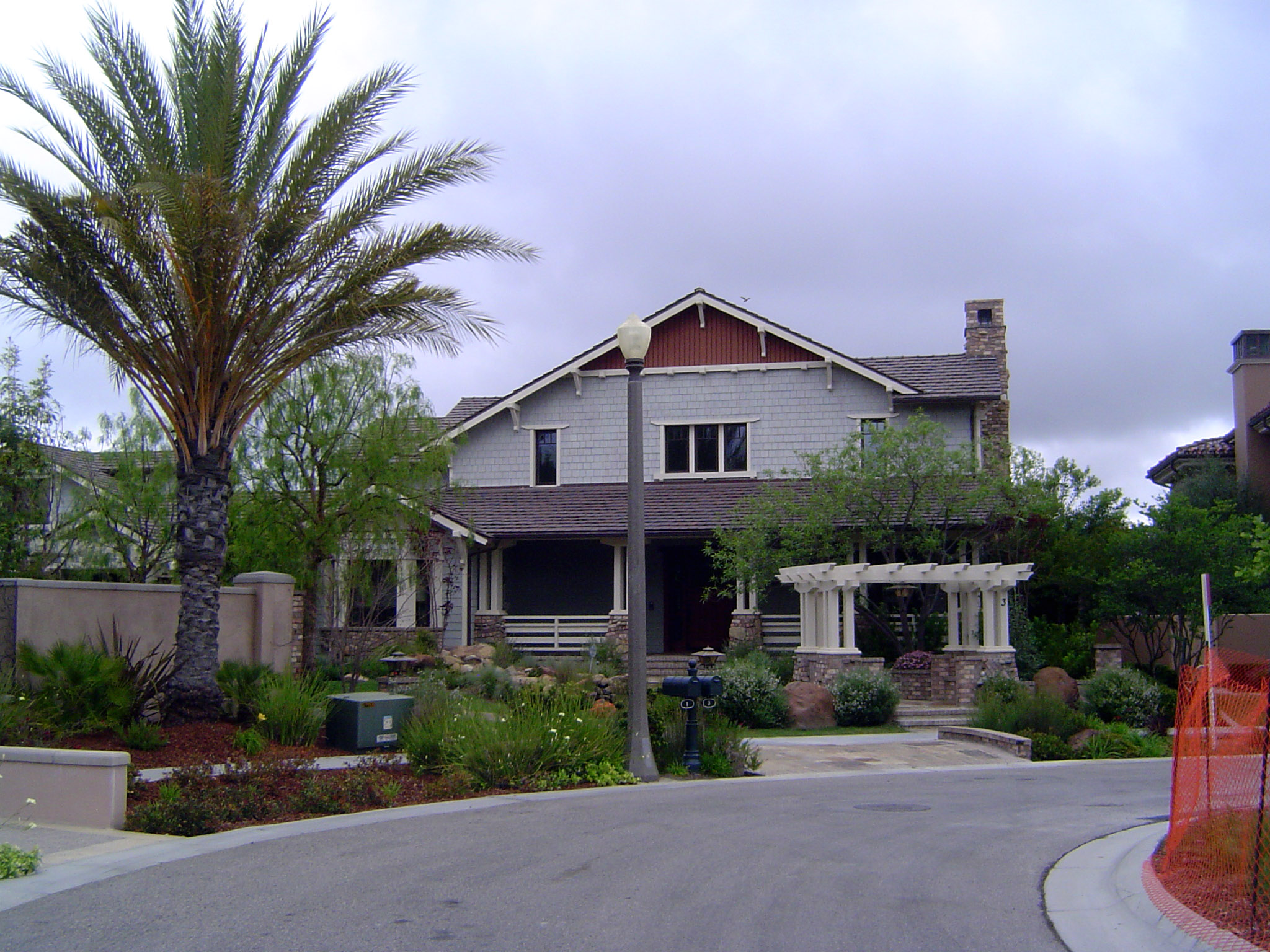 Pergola and palms, with underground wiring.