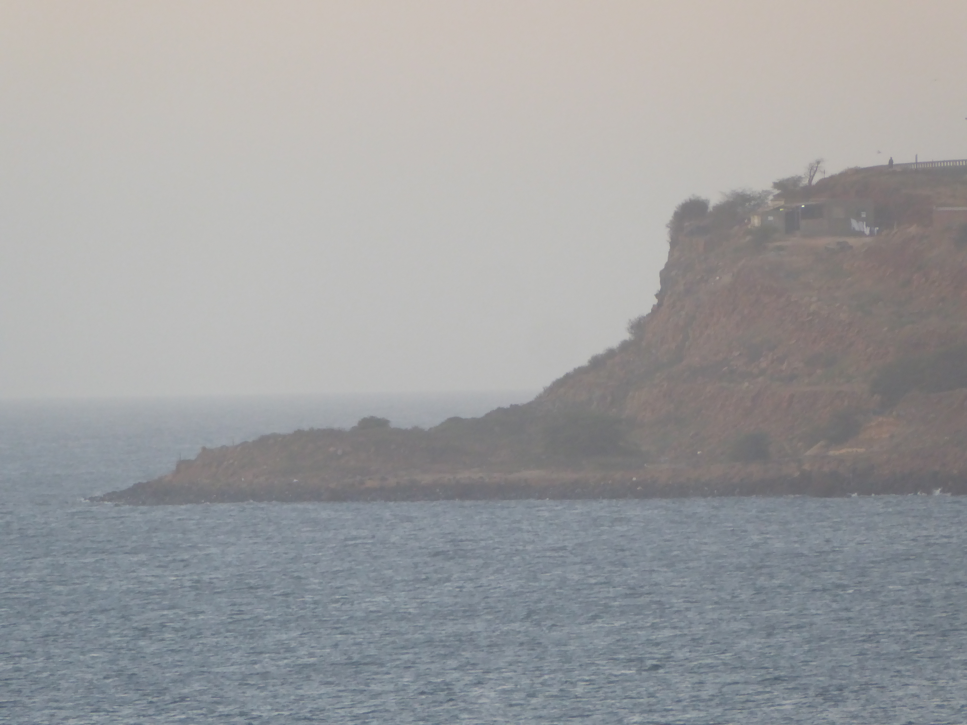 Here's a hazy Cap Manuel, the tip of the hook of the Cape Verde Peninsula. You might like to sit at the point it's one of those geographical
