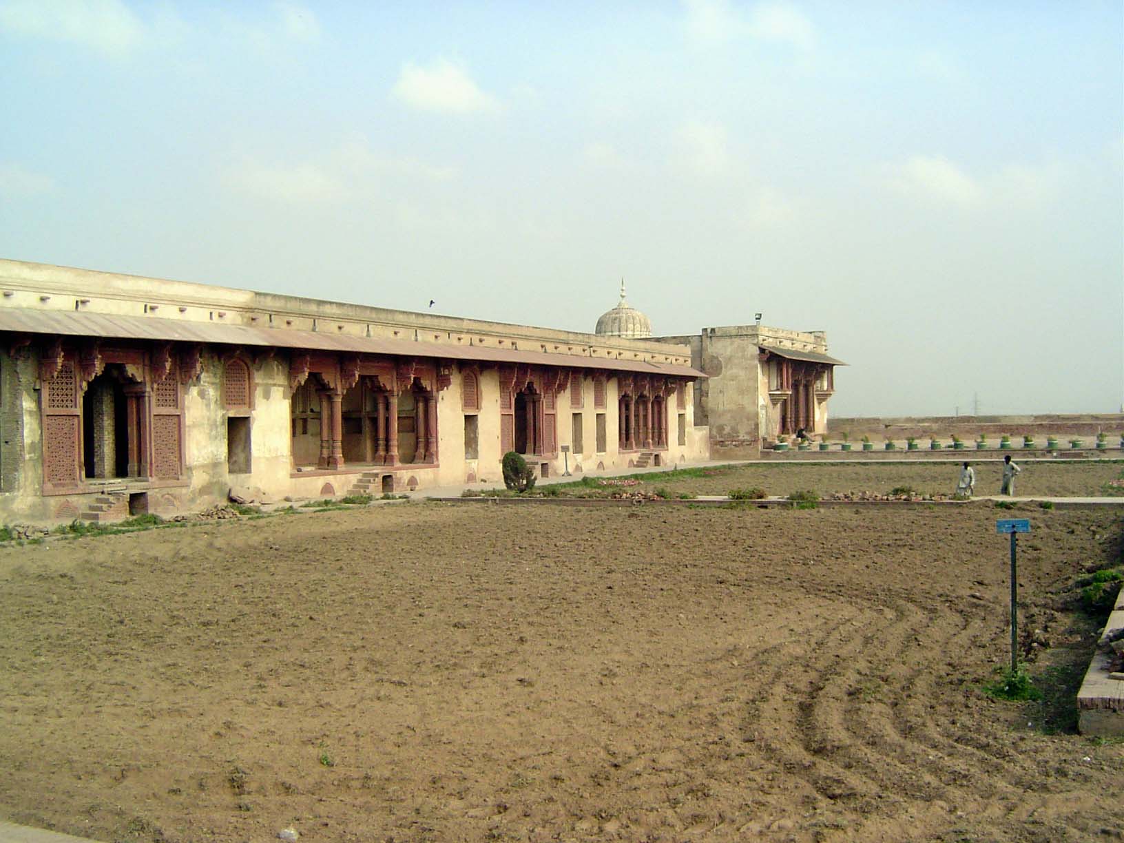 The sides of the quadrangle are rimmed with dalans or porticos. We'll take a closer look at that building at the far end.