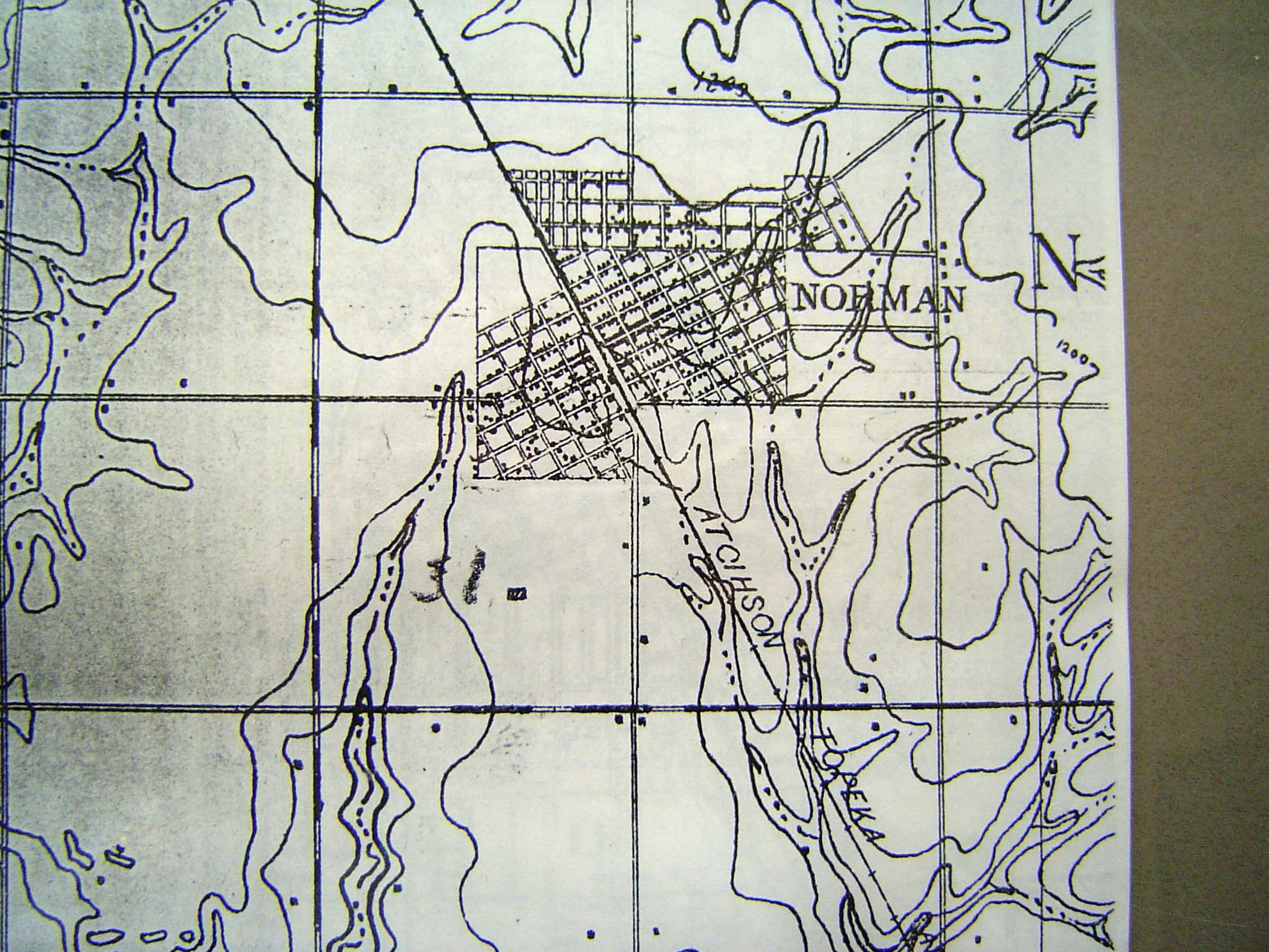 A U.S.G.S. topo sheet from 1893 shows the AT\&SF railroad and the original townsite grid of two quarter-sections oriented to the track. It s